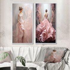 two paintings of women in pink dresses on the wall next to a white couch and coffee table