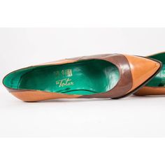 Lovely and very unique vintage 1970s Fred Slatten for Totar leather pumps. Two toned leather in chocolate brown and caramel exquisitely crafted with curvy oblong color blocking sewn with surgeons precision. Spool heel and pointed toe. Side profile of the shoe is gorgeously curved. Thick leather sole and bright Kelly green leather sock lining. The heel caps have been replaced. Very small and narrow, please read full description with measurements below. | MEASUREMENTS | :: Fits a modern size 5(ver Color Block Heels, Spool Heel, Shoes Vintage, Leather Socks, Heel Caps, Side Profile, Kelly Green, Vintage Shoes, Green Leather