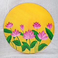 a painting of pink flowers in front of a yellow circle with green leaves on it