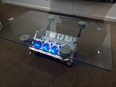 an engine block is sitting on top of a glass table