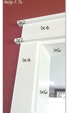 the measurements for different sizes of mirrors are shown in front of a wall mounted mirror