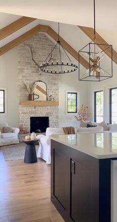 a living room filled with furniture and a fire place in the middle of a room