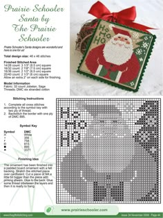 a cross stitch christmas ornament with santa