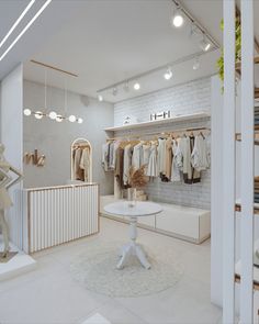 a room filled with lots of white furniture and clothes hanging on the racks in front of it