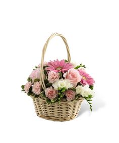 a basket filled with pink and white flowers