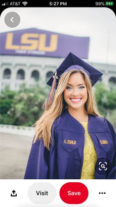 a woman wearing a purple graduation cap and gown in front of the lsu football stadium