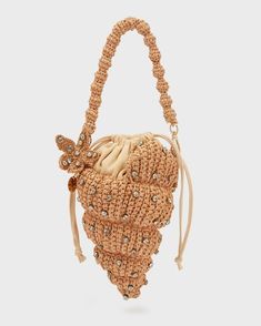 a handbag with beaded details on the front and side, hanging from a string