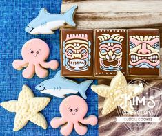 some cookies are decorated to look like animals and other things in the shape of stars