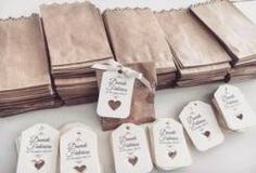 wedding favors and tags laid out on a table