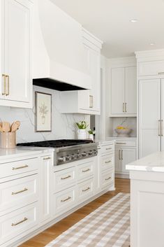 the kitchen is clean and ready for us to use it's white cabinetry