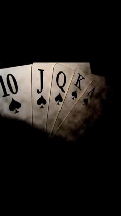 four playing cards with the number 10 on them in front of a black background that says jox