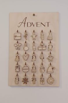 an advertise with many charms hanging on it's side, including christmas decorations