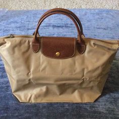 New With Tags. Base Is 12wx11hx7d. Top Zip Across Is 18” Opening. Tan Canvas 4” Drop Top Handle Tote. Longchamp Khaki, Longchamp Backpack Beige, Longchamp Beige, Longchamp Large Le Pliage Tote, Longchamp Le Pilage Backpack, Longchamp Bags, Drop Top, Longchamp Le Pliage, Womens Tote Bags