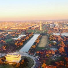 an aerial view of the washington monument in autumn