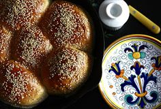 some bread is in a pan next to a plate