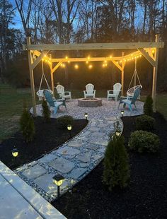 an outdoor patio with chairs and string lights on the pergolated area at night