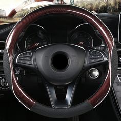 the interior of a car with steering wheel cover