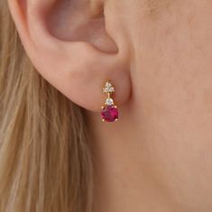 Round Ruby Stud Earrings with Diamonds in 14K Solid Gold, July Ruby Birthstone Earring,  Dainty Diamond Stud, Minimal Gold Stud, Single Stud FEATURES Ruby Carat:  Single: 0.50 ct - Pair: 1.00 ct Diamond Carat: Single: 0.06ct - Pair: 0.12ct Color: F Clarity: Vs Cut: Excellent Width: 4.50 mm / 0.18 in Height: 12 mm / 0.47 mm  Material: 14K Solid Gold We are aware of your excitement about our product, and we share that enthusiasm with you. You can count on us to handle your order with the utmost care and attention to detail. Ensuring your satisfaction is our top priority, and we're here to make sure you have a wonderful shopping experience. If you have any questions or specific requests, please don't hesitate to reach out. We're committed to providing excellent service and look forward to ser Ruby Studs Indian, Ruby Studs Gold, Ruby Round Cut Fine Jewelry Earrings, Brilliant Cut Ruby Round Earrings, Ruby Gemstone Earrings Round Cut, Ruby Stud Earrings, Diamond Solitaire Earrings, Ruby Earrings Studs, Minimal Gold