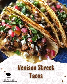 three tacos on a blue plate with the words venison street tacos