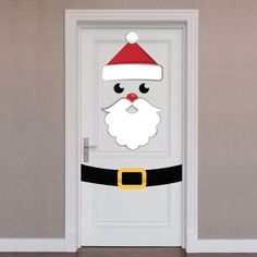 a door decorated with a santa claus face