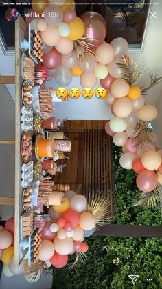 an overhead view of balloons and desserts on display