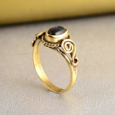 Spiral Black Obsidian Ring in brass, Protection Strength Ring, Minimalist Delicate Ring, personalized gift, handmade gift, gift for her Stone: - obsidian Material: - Brass Size: - Any ♥Please Make Sure to Include The Correct Address During Before Ordering. You Can return the Item within 30 Days After Successful Delivery. We offer a 100% Money Back Guarantee If You are unsatisfied with Your Purchase. Return Charge Will Be Paid By Buyer Only. Thank you for visiting my shop!              jaipurjewe Yellow Gold Brass Moonstone Ring For Gift, Black Brass Rings For Gift, Gift Brass Moonstone Ring, Hand Forged Brass Rings As Gift, Black Obsidian Ring, Obsidian Ring, Ring Minimalist, Black Obsidian, Delicate Rings