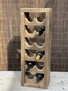 a wooden wine rack filled with lots of bottles