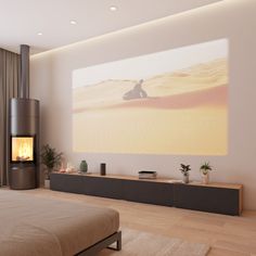 a bedroom with a large screen on the wall