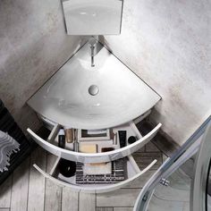 an aerial view of a bathroom sink and mirror