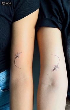 two women with matching tattoos on their arms