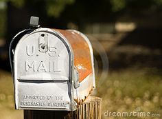 an old mailbox is sitting in the grass