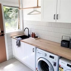 a washer and dryer in a small kitchen