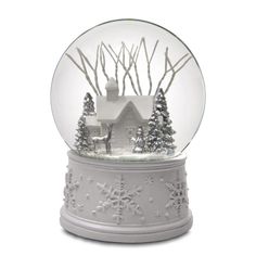 a snow globe with houses and trees inside