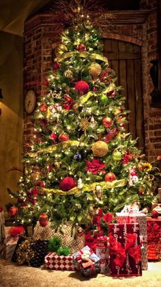 a christmas tree with presents under it