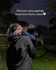 two people hugging each other in front of a fence with the caption saying,