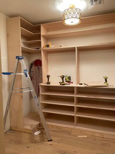 a ladder is standing in front of some shelves