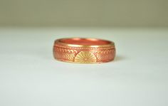 "1938 Japanese 1 Sen Coin Ring w/Dusky Rose nanoceramic: - Glowing Brass Coin Ring - Your choice of Nano Ceramic Color. (see the second photo) - Comes in a cute box ready for gift giving. - Made to order, just for you. These rings are handcrafted using a rare brass Japanese One Sen Coin. Issued only in 1988 they feature a beautiful wave and cherry blossom design that will be on the outside of the ring. The inside of the ring features the date and issuing authority in Japanese script. You can see Vintage One-of-a-kind Wedding Rings, Bohemian Engraved Ring As Gift, Bohemian Engraved Ring As A Gift, Vintage Carved Rings For Gift, Vintage Carved Rings For Gifts, Vintage Carved Rings As Gifts, Bohemian Etched Engraved Ring As Gift, Bohemian Carved Wedding Ring, Handmade Art Deco Gold Ring