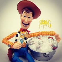 a toy figure sitting next to an ice bucket