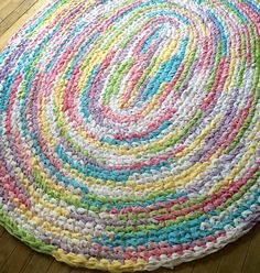 a multicolored round rug on the floor