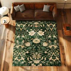 an overhead view of a living room with a couch, coffee table and rug on the floor