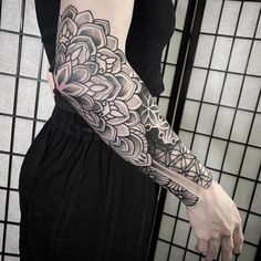 a woman with a tattoo on her arm