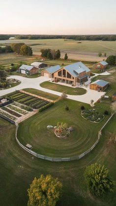 an aerial view of a large farm house