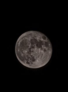 the full moon is seen in the dark sky