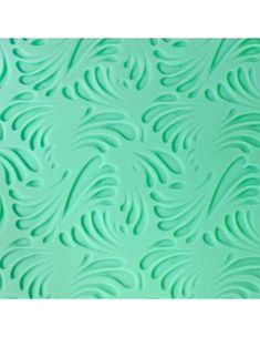 a close up view of a green surface with wavy lines and curves in the center