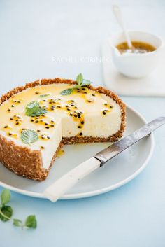 a piece of cheesecake on a plate with a knife