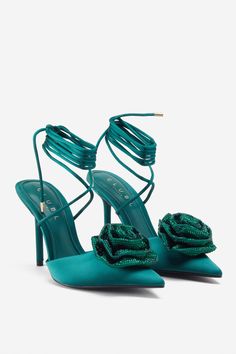 Elevate any formal ensemble with the addition of Sharpened, our chic green stiletto pumps. Decorated with a crystal-studded flower detail, these pointed-toe heels are fastened with satin ankle ties and padded soles ensure maximum comfort. Features - Premium satin- Diamanté flower detail- Pointed toe- Lace-up fastening- Stiletto heel- Heel height: 3.9in/10cm Product Information Designed exclusively by Club L LondonPremium satin in Green (100% Polyester Satin)SKU: CL128746047 Wide Calf Cowgirl Boots, Turquoise Heels, Mary Jane Shoes Black, White Block Heels, Party Dress Long Sleeve, Wide Calf Boots, Flower Detail, Pointed Toe Heels, Bottle Green