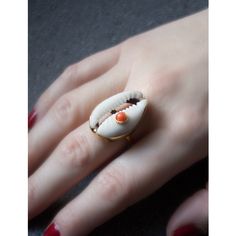 A reminder that sunny days are on the horizon, this stunning ring is carefully handmade from 18k gold over sterling silver wrapping a white cowrie shell marked with a pretty coral bead. Style it with similar styles from the Marina collection. Presented in a Vintouch signature packaging. Handmade from 18-karat Yellow Gold Over Sterling Silver (1-micron plating). We suggest to avoid contacts with soaps, detergents, chlorine and any other chemical substance that could alter the original characteris Summer Beach Jewelry Ring, Beach Summer Jewelry Ring, Summer Beach Ring Jewelry, White Shell Jewelry Gift, Handmade Open Ring Jewelry For Beach, Unique White Shell Jewelry, Handmade White Shell Rings, Unique Gold Jewelry For Vacation, White Shell-shaped Rings For Beach