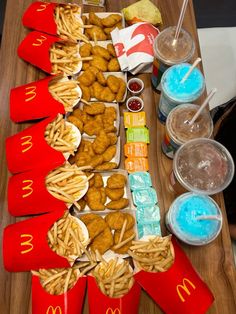 a table topped with lots of food and drinks