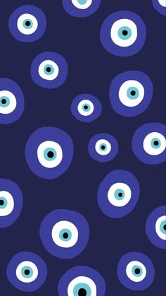 an image of blue and white eyeballs on a dark background with black circles in the middle