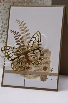 a close up of a card with a butterfly on it